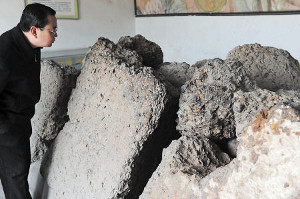 Large chunks of the unearthed iron coins on display