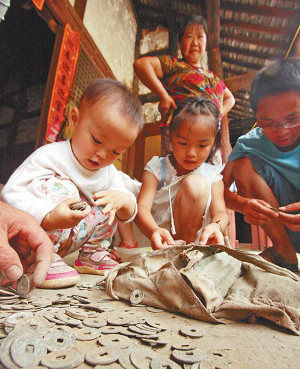 Children playing with ancient Chinese coins