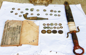 Unearthed coin cache included a sword and copy of Book of Songs