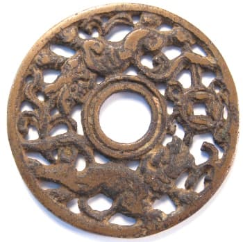 Chinese open work charm displaying
              two lions playing with a treasure coin