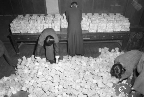 Local bank employees preparing for a customer's cash withdrawal