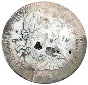 Spanish silver dollar found in pile of dirt