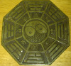 Reverse side of jade charm displaying eight trigrams
