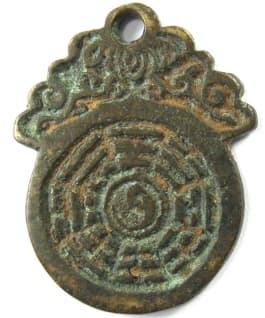 Chinese charm
              with bagua (eight trigrams) and taiji (yinyang) symbol