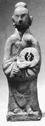 Tomb figure of a man holding a "luo pan" or
            geomancer's compass excavated from a Southern Song Dynasty
            tomb